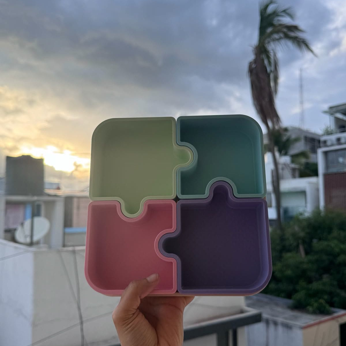 Piece of Mind puzzle tray held at sunset