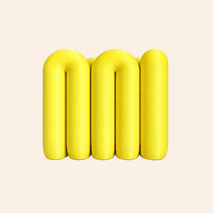 The Loop Stand in yellow on a warm white background