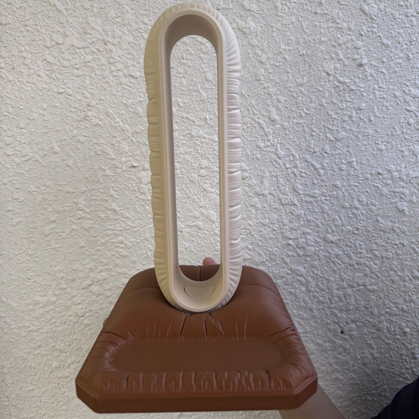 Cushion Headspace in beige-brown, detail of the ruched arch and base