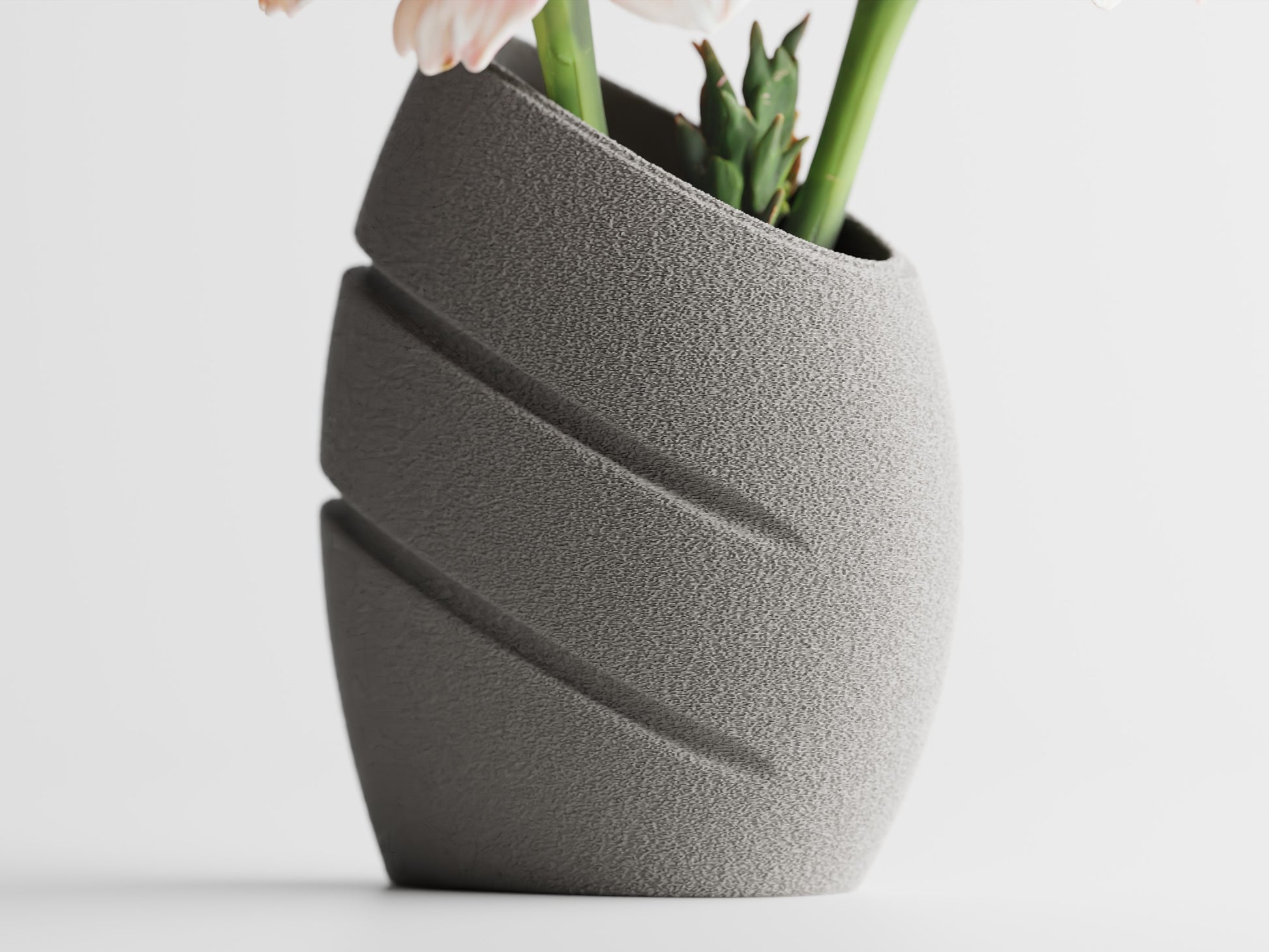 Ellipse vase holding a single bloom on a table