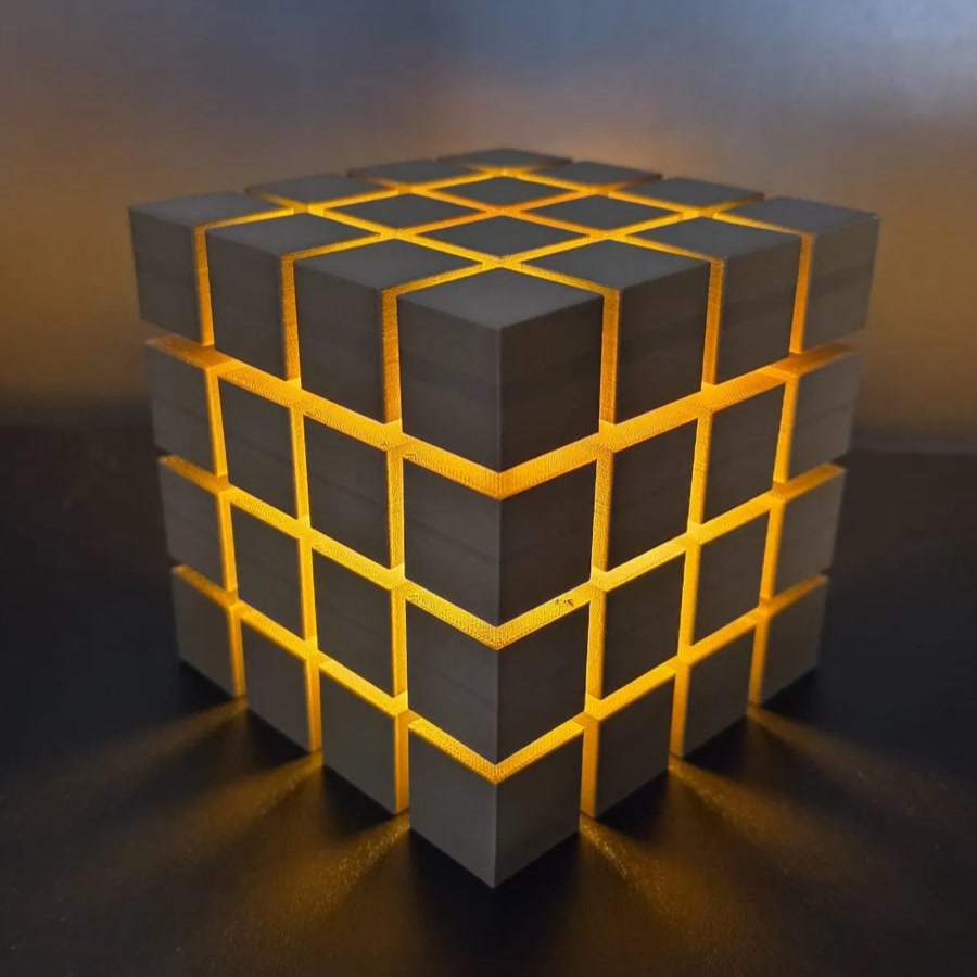 Rubrik Lamp — Grey lamp with yellow diffuser glow