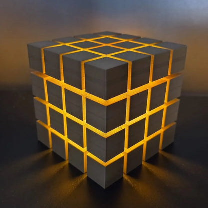 Rubrik Lamp — Grey lamp with yellow diffuser glow