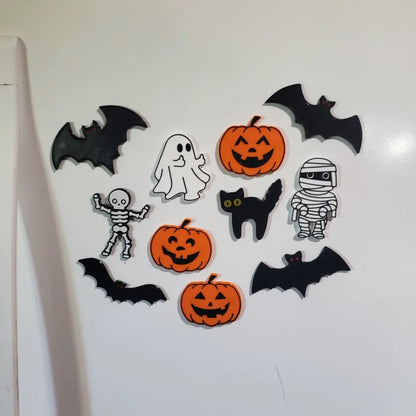 Ten Halloween fridge magnets arranged on a fridge - bats, pumpkins, skeleton, mummy, black cat, ghost