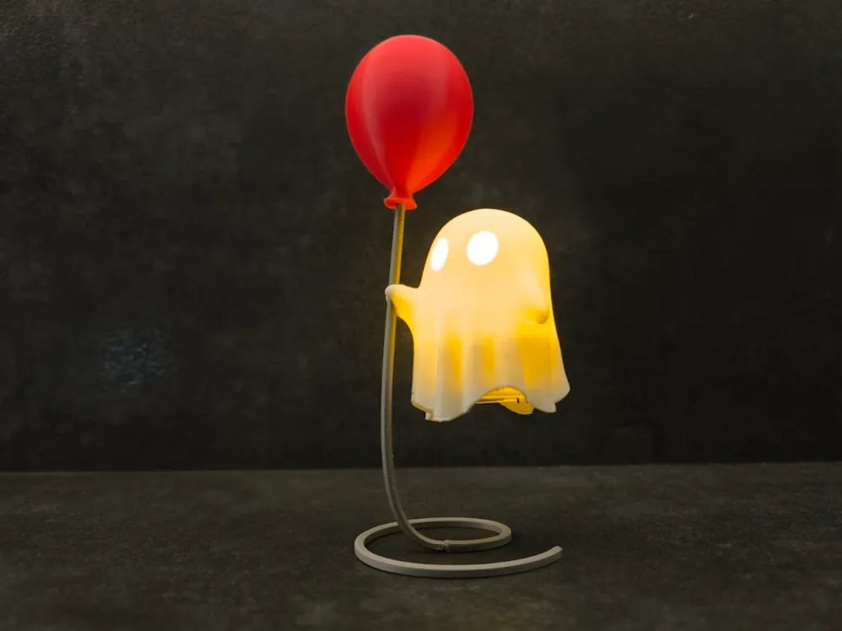 Balloon Ghost - a cheerful ghost tealight holding a red balloon on a wire stand (primary)