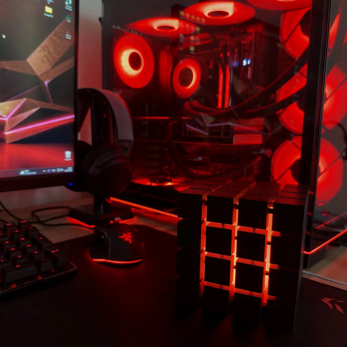 Rubrik Lamp on a gaming desk with red RGB glow