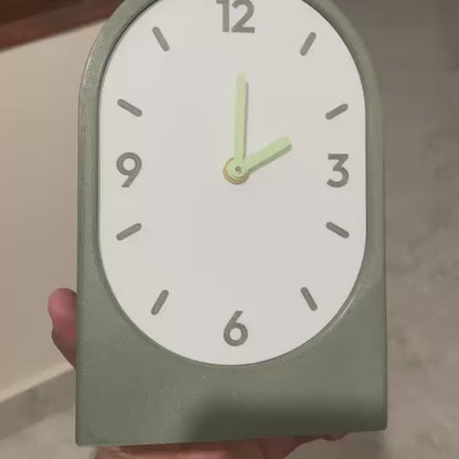 Solace clock held in hand - olive horizontal
