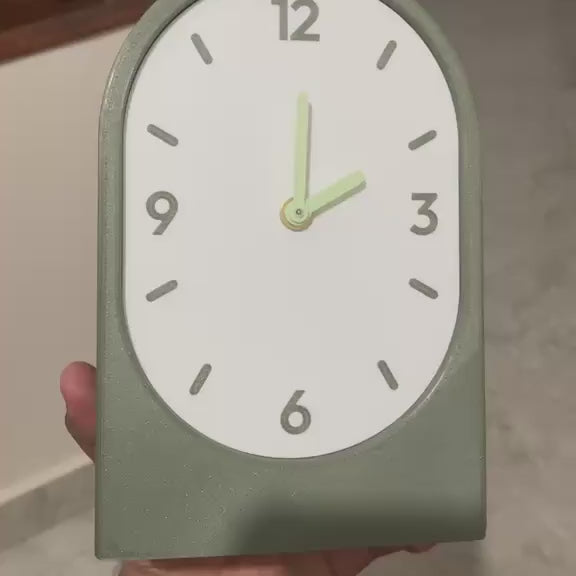 Solace clock held in hand - olive horizontal