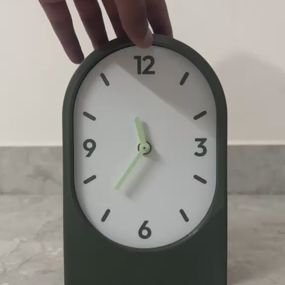 Solace clock on a counter - olive vertical