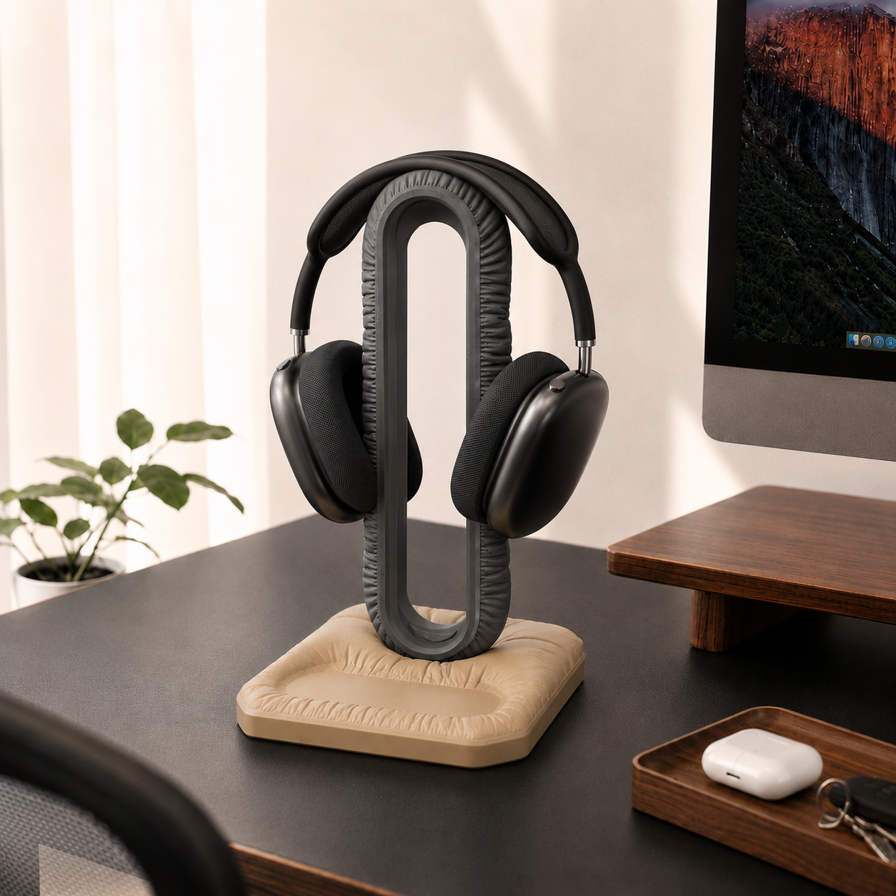 Cushion Headspace holding over-ear headphones on a desk