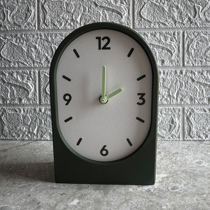 Solace clock in olive, vertical arch on a shelf