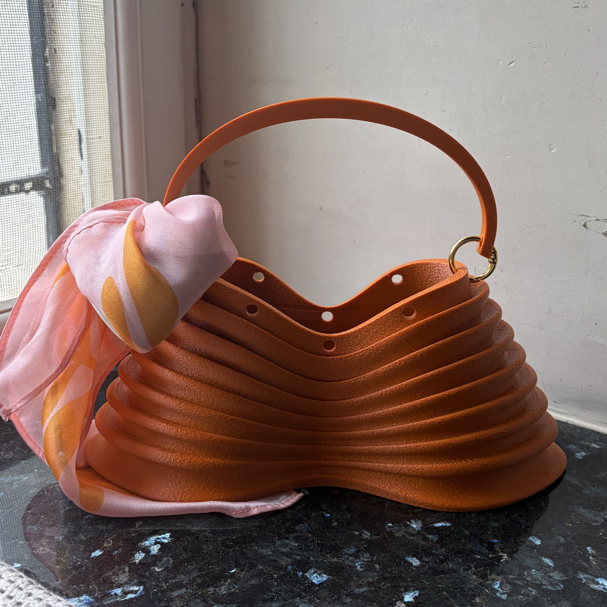Thorax Bag side profile by a window, backlit