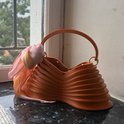 Thorax Bag side profile on marble in daylight
